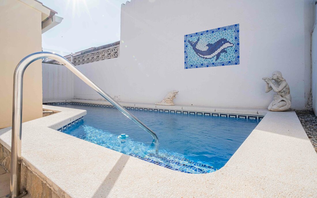 Stunning 4-bedroom house with pool, steps away from the beach and town center. Perfect location for 
