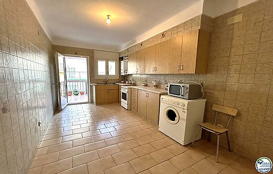 Flat situated in the centre of the village with large garage.